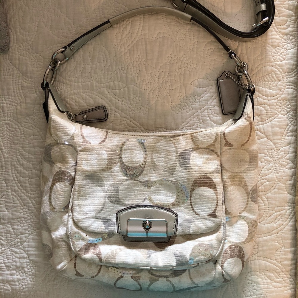Coach hobo  bag. Little spot covered by flap.